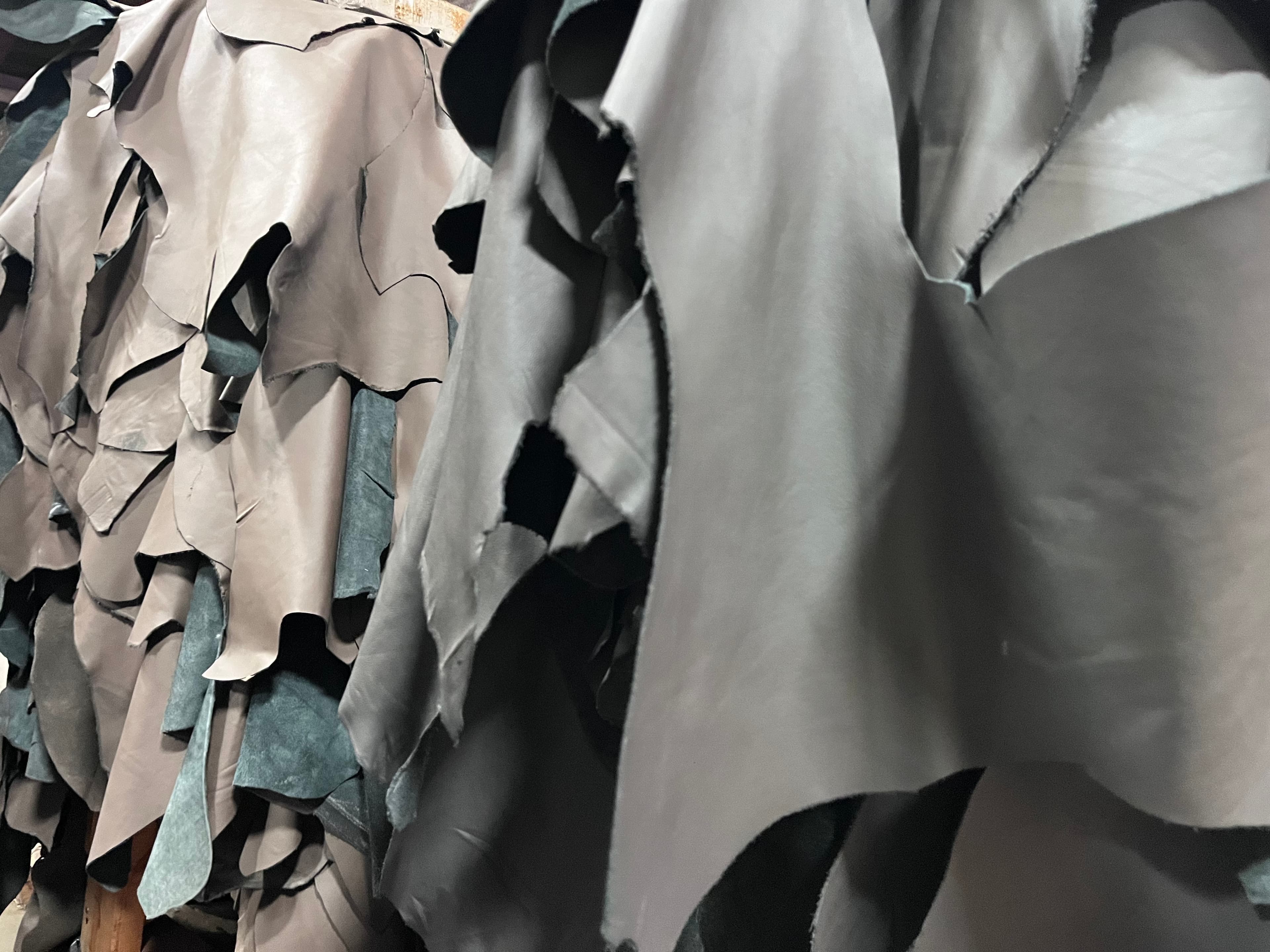 Surplus leather hides and cut pieces on hand at Core Products Group — automotive and contract grade